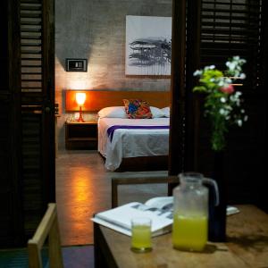 מיטה או מיטות בחדר ב-Casa Mermejita