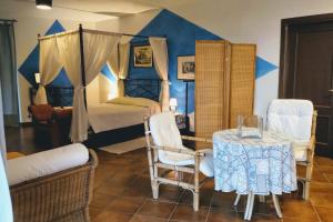 Posteľ alebo postele v izbe v ubytovaní Agriturismo Tenuta Monte La Guardia