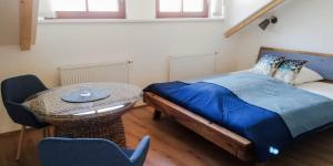 Postel nebo postele na pokoji v ubytování Apartmány Cechovní