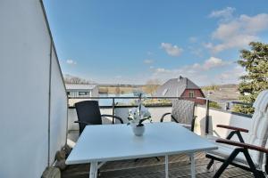 a table and chairs on a balcony with a view at Appartementanlage am Taschensee Taschensee Appartement 9 in Gronenberg +22 photos
