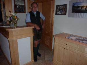 a man in uniform standing in a room at Appartement-Pension Familie Gewessler in Bad Mitterndorf