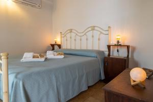 Postel nebo postele na pokoji v ubytování Agriturismo Case Don Ignazio