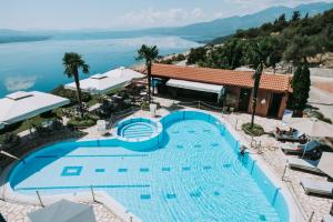 an overhead view of a swimming pool at a resort at Althaia Hotel in Thermo