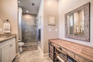 a bathroom with a shower and a sink and a mirror at Mexico Beach Getaway with Patio - Steps to Beach! in Mexico Beach +21 photos