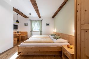 Rúm í herbergi á Gasthof Tschötscherhof
