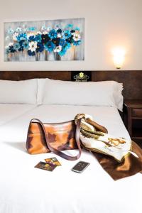 Postelja oz. postelje v sobi nastanitve Aston Hotel