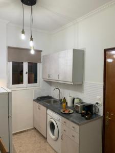 A kitchen or kitchenette at ''Korifo apartment'' at Benitses