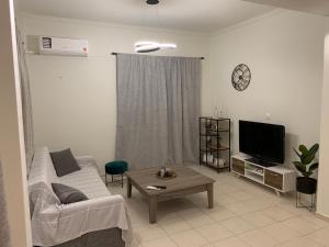 A television and/or entertainment centre at ''Korifo apartment'' at Benitses