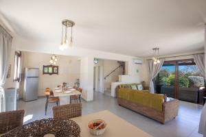 a living room with a couch and a table at Villa Margarita in Protaras +20 photos