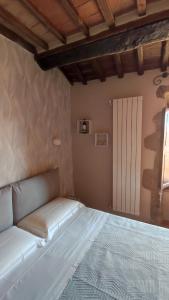 Etrusco Home & Relax tesisinde bir odada yatak veya yataklar