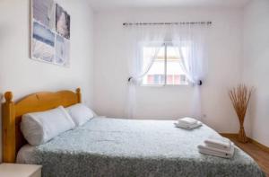 Łóżko lub łóżka w pokoju w obiekcie Karin House