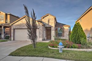 a blue fire hydrant in front of a house at San Antonio Abode Near Golf, Shops and Dining! in San Antonio
