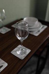 a wine glass sitting on a napkin on a table at City Centre Studio 9 with Kitchenette, Free Wifi and Smart TV with Netflix by Yoko Property in Middlesbrough