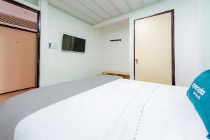 Posteľ alebo postele v izbe v ubytovaní Ayenda Portal del Cable