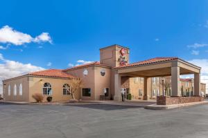 a building with a clock tower on top of it at Best Western Plus Winslow Inn in Winslow