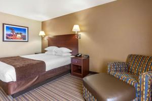Voodi või voodid majutusasutuse Best Western Plus Winslow Inn toas