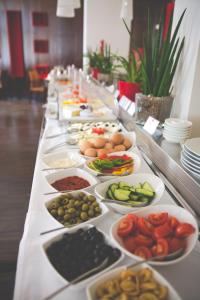 a buffet line with many different types of food at The Levante Parliament A Design Hotel in Vienna