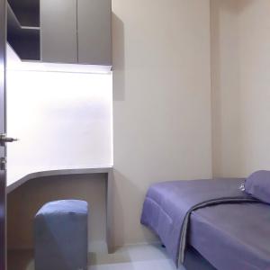 Säng eller sängar i ett rum på High Livin Apartment Pasteur