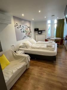 Ένα ή περισσότερα κρεβάτια σε δωμάτιο στο Hotel De Backer