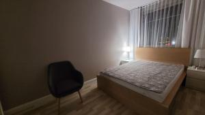 Posteľ alebo postele v izbe v ubytovaní APARTAMENT25b, plaża, internet, NETFLIX