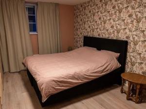 Postel nebo postele na pokoji v ubytování Elegant holiday home in Putten with courtyard
