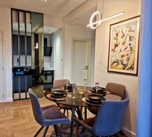 a dining room with a table and chairs at Villa Preciosa in Kotor