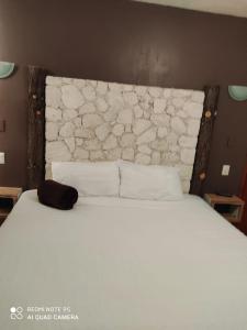 Posteľ alebo postele v izbe v ubytovaní Hotel Beraka