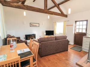 a living room with a couch and a table at Beacon in Saltburn-by-the-Sea