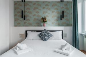 A bed or beds in a room at The Venue Spagna
