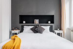 A bed or beds in a room at The Venue Spagna