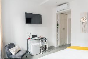 A television and/or entertainment centre at The Venue Spagna