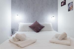 A bed or beds in a room at The Venue Spagna