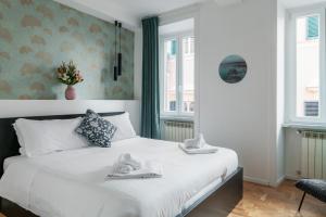 A bed or beds in a room at The Venue Spagna