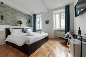 A bed or beds in a room at The Venue Spagna
