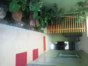 a room with potted plants on the wall at Shore Time Hotel - Annex in Boracay