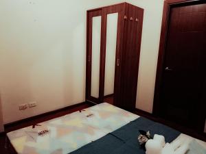 an empty room with a bed and a door at 1bedroom Condo For rent with WiFi pool and gym in Cebu City