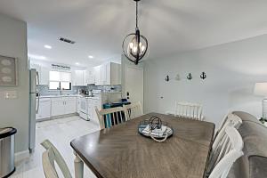 a kitchen and dining room with a table and chairs at Fiddlers Cove III in Hilton Head Island