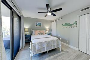 a bedroom with a bed and a ceiling fan at Fiddlers Cove III in Hilton Head Island