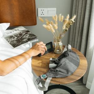 a person taking a picture of a table with a camera at Em Oi Boutique Hotel in Nha Trang