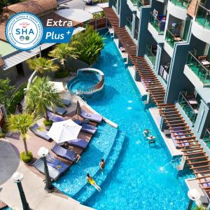 an aerial view of a swimming pool at a resort at Ramaburin Resort Patong - SHA Extra Plus in Patong Beach