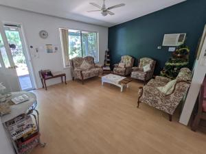 a living room filled with furniture and a couch at The Cottage on George Street in Jarrahdale