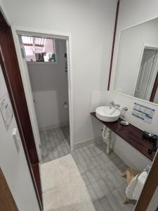 a bathroom with a sink and a mirror at The Cottage on George Street in Jarrahdale