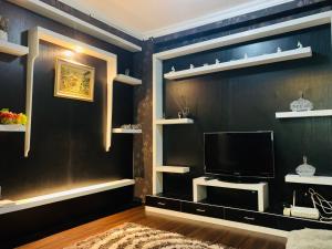 A television and/or entertainment centre at Apartemen Cibubur Village by Raja Sulaiman Property