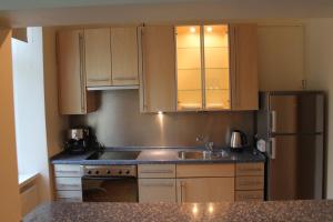 A kitchen or kitchenette at Old Riga Apartment