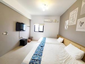Postelja oz. postelje v sobi nastanitve New Summer Homestay
