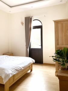 Giường trong phòng chung tại Gia An - hotel in Dalat