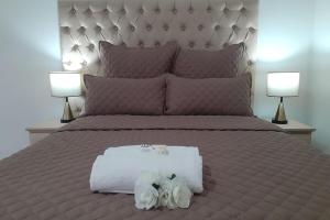 Кровать или кровати в номере Queens Palace