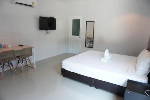 Katil atau katil-katil dalam bilik di กรณวรรณ รีสอร์ท