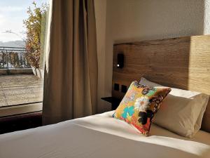Postel nebo postele na pokoji v ubytování Hotel Les Mésanges