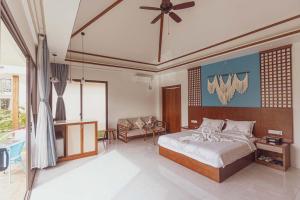 Postel nebo postele na pokoji v ubytování Amphitrite Resort + 37 fotografií